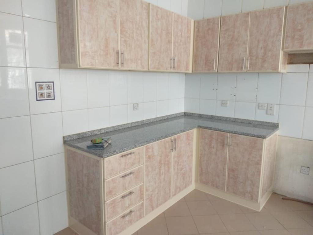 Kitchen cabinets made with wood and marble top